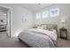 Comfortable bedroom with soft decor and plush bedding, complemented by ample natural light at 8075 S Vandriver Way, Aurora, CO 80016