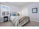 This cozy bedroom features a comfortable bed and a bright window, creating a relaxing atmosphere at 8075 S Vandriver Way, Aurora, CO 80016