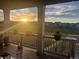 Covered deck offers views of the golf course and a tranquil sunrise at 8075 S Vandriver Way, Aurora, CO 80016