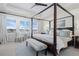 Bright bedroom with a four-post bed, large windows, and stylish décor creates a peaceful retreat at 8075 S Vandriver Way, Aurora, CO 80016