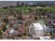Aerial view of the property showcasing its proximity to a lush green park and the surrounding neighborhood at 1090 N Lafayette St # 305, Denver, CO 80218
