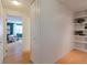 Hallway with multiple closets and views into the living room with closet storage at 1090 N Lafayette St # 305, Denver, CO 80218