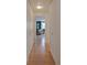 Hallway showcasing hardwood floors, closet space, and access to a well-lit room at 1090 N Lafayette St # 305, Denver, CO 80218