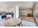 Cozy kitchen features white cabinets, black countertops, and a breakfast nook at 1090 N Lafayette St # 305, Denver, CO 80218
