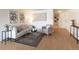 Comfortable living room with neutral tones, modern decor, and wood-style flooring at 1090 N Lafayette St # 305, Denver, CO 80218