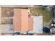 Aerial view of the house, showcasing the roof, backyard with trampoline and basketball hoop, and surrounding landscape at 7511 Locust St, Commerce City, CO 80022