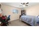 Neutral bedroom with carpet and natural light, featuring a desk area and a bed at 7511 Locust St, Commerce City, CO 80022