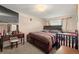 Comfortable bedroom featuring a bed, a vanity and abundant natural light at 7511 Locust St, Commerce City, CO 80022