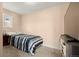 Simple bedroom featuring a blue striped bed with neutral walls and carpet creating a comfortable and relaxing atmosphere at 7511 Locust St, Commerce City, CO 80022