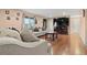 Cozy living room featuring neutral colors, plush seating, and a fireplace, creating a warm atmosphere at 7511 Locust St, Commerce City, CO 80022
