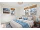 Bright bedroom with neutral decor and ample natural light at 3428 S Sherman St, Englewood, CO 80113