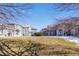 Complex of gray houses with a grassy yard at 3428 S Sherman St, Englewood, CO 80113