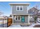 Gray two-story house with teal door and small front yard at 3428 S Sherman St, Englewood, CO 80113