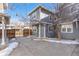 Townhouse exterior, gray siding, teal door, walkway at 3428 S Sherman St, Englewood, CO 80113