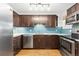 Modern kitchen with stainless steel appliances and blue tile at 3428 S Sherman St, Englewood, CO 80113