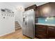 Modern kitchen with stainless steel refrigerator and granite countertops at 3428 S Sherman St, Englewood, CO 80113