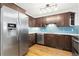 Kitchen with stainless steel appliances and blue tile backsplash at 3428 S Sherman St, Englewood, CO 80113