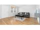 Living room with hardwood floors, gray couch, and a coffee table at 3428 S Sherman St, Englewood, CO 80113