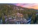 An aerial view of the mountain home, displaying its layout, lush surroundings, and inviting pathway at 30 W Ranch Trl, Morrison, CO 80465