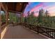 Enjoy breathtaking views from this balcony, featuring wood railings and a seamless transition to the surrounding nature at 30 W Ranch Trl, Morrison, CO 80465