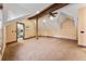 Bonus room featuring wooden beams, hardwood floors, and an open layout with an adjacent room at 30 W Ranch Trl, Morrison, CO 80465