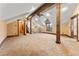 Large bonus room featuring wood beams and an open layout with hardwood flooring at 30 W Ranch Trl, Morrison, CO 80465