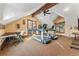 Home gym with treadmills, exercise equipment, natural light, and a wooden beam at 30 W Ranch Trl, Morrison, CO 80465
