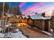 A stunning exterior view of a luxury mountain home featuring beautiful design, stone accents, and a paved driveway at 30 W Ranch Trl, Morrison, CO 80465