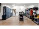Organized garage featuring storage cabinets, a workbench, and epoxy floors for easy maintenance at 30 W Ranch Trl, Morrison, CO 80465