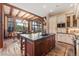 Open kitchen dining area with a large kitchen island, ample cabinetry and counter space for food prep at 30 W Ranch Trl, Morrison, CO 80465
