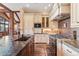 Custom kitchen with granite countertops, backsplash, stainless steel appliances, hardwood floors and ample cabinets at 30 W Ranch Trl, Morrison, CO 80465