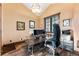 Spacious office featuring vaulted ceilings, natural light, and beautiful wood floors at 30 W Ranch Trl, Morrison, CO 80465