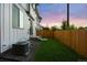 Newly landscaped backyard with green grass and fence providing privacy at 4030 Upham St, Wheat Ridge, CO 80033