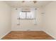 This bedroom has warm hardwood floors, neutral walls and natural light at 3355 Wright St, Wheat Ridge, CO 80033