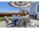 Backyard features a patio with outdoor dining set, perfect for entertaining, with a new grill and lush lawn at 542 W 173Rd Ave, Broomfield, CO 80023