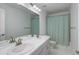 Bathroom with double sinks, a large mirror and neutral colors at 542 W 173Rd Ave, Broomfield, CO 80023
