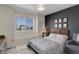 Charming bedroom with a dark accent wall and abundant natural light at 542 W 173Rd Ave, Broomfield, CO 80023