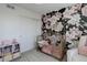 Floral wall in the Bedroom with a gold crib at 542 W 173Rd Ave, Broomfield, CO 80023