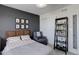 Well-lit bedroom featuring a dark accent wall and comfortable seating at 542 W 173Rd Ave, Broomfield, CO 80023
