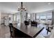 Elegant dining area with a view into the living area and open kitchen layout at 542 W 173Rd Ave, Broomfield, CO 80023