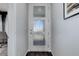 Clean and bright entryway featuring a modern front door and hardwood floors at 542 W 173Rd Ave, Broomfield, CO 80023