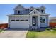 Charming two-story home with a well-manicured lawn and inviting front entrance at 542 W 173Rd Ave, Broomfield, CO 80023