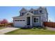 Charming two-story home featuring a well-manicured lawn and attached two-car garage at 542 W 173Rd Ave, Broomfield, CO 80023