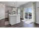Bright and spacious kitchen features a center island and sliding doors to the outdoor patio at 542 W 173Rd Ave, Broomfield, CO 80023