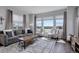 Inviting living room with plush seating, large windows, and a stylish area rug at 542 W 173Rd Ave, Broomfield, CO 80023