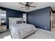 Serene main bedroom with natural light, a ceiling fan, and a luxurious upholstered headboard at 542 W 173Rd Ave, Broomfield, CO 80023