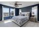 Serene main bedroom with natural light, a ceiling fan, and a luxurious upholstered headboard at 542 W 173Rd Ave, Broomfield, CO 80023