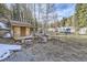 Rustic backyard with small shed and door mural, wood spool table and silver Airstream trailers at 2971 Fall River Rd, Idaho Springs, CO 80452