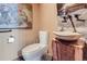 Stylish powder room features a unique stone sink and vessel with designer fixtures and modern toilet at 2971 Fall River Rd, Idaho Springs, CO 80452