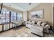 Inviting bedroom features stylish decor, a comfortable seating area and an abundance of natural light at 2971 Fall River Rd, Idaho Springs, CO 80452